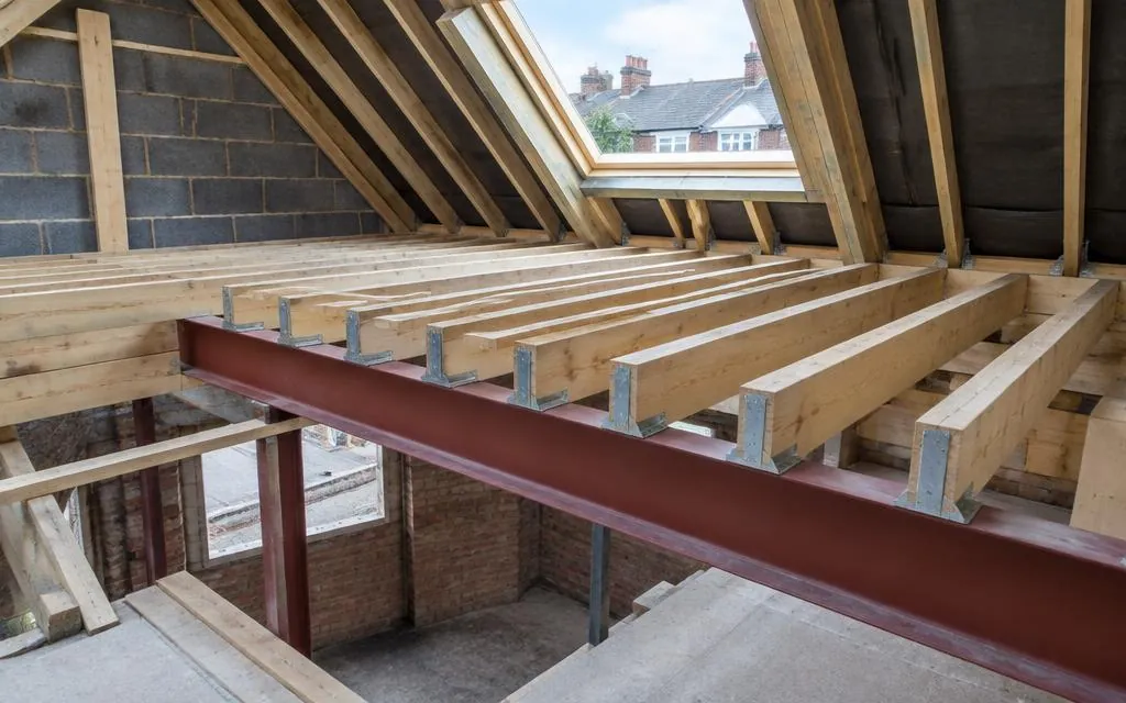 New timber floor joists and steel beam in a loft conversion